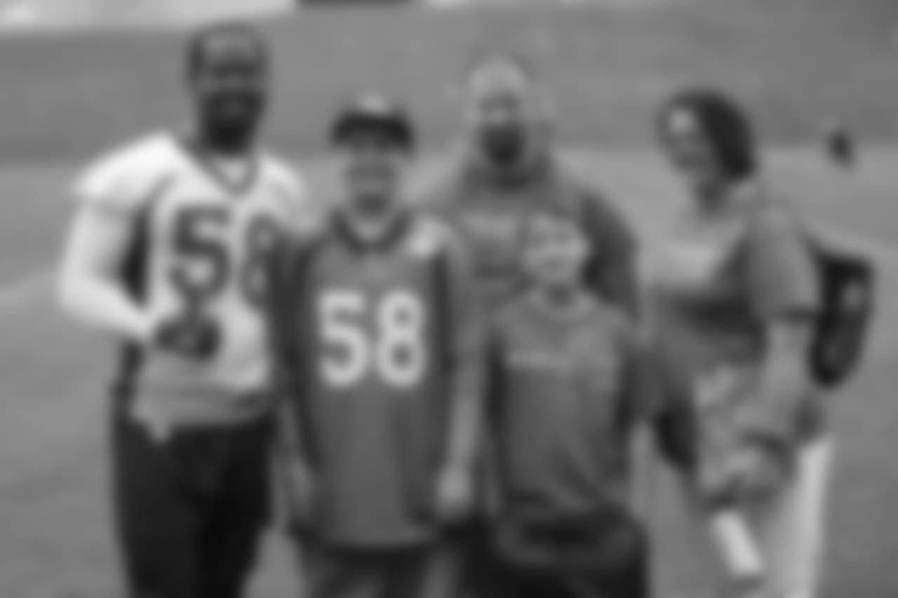 TJ, a 12-year-old fighting cystic fibrosis, wanted to be Von Miller for a day, and the Make-A-Wish Foundation helped make that dream come true on September 29, 2018. Here, Miller and the family take a group photo.