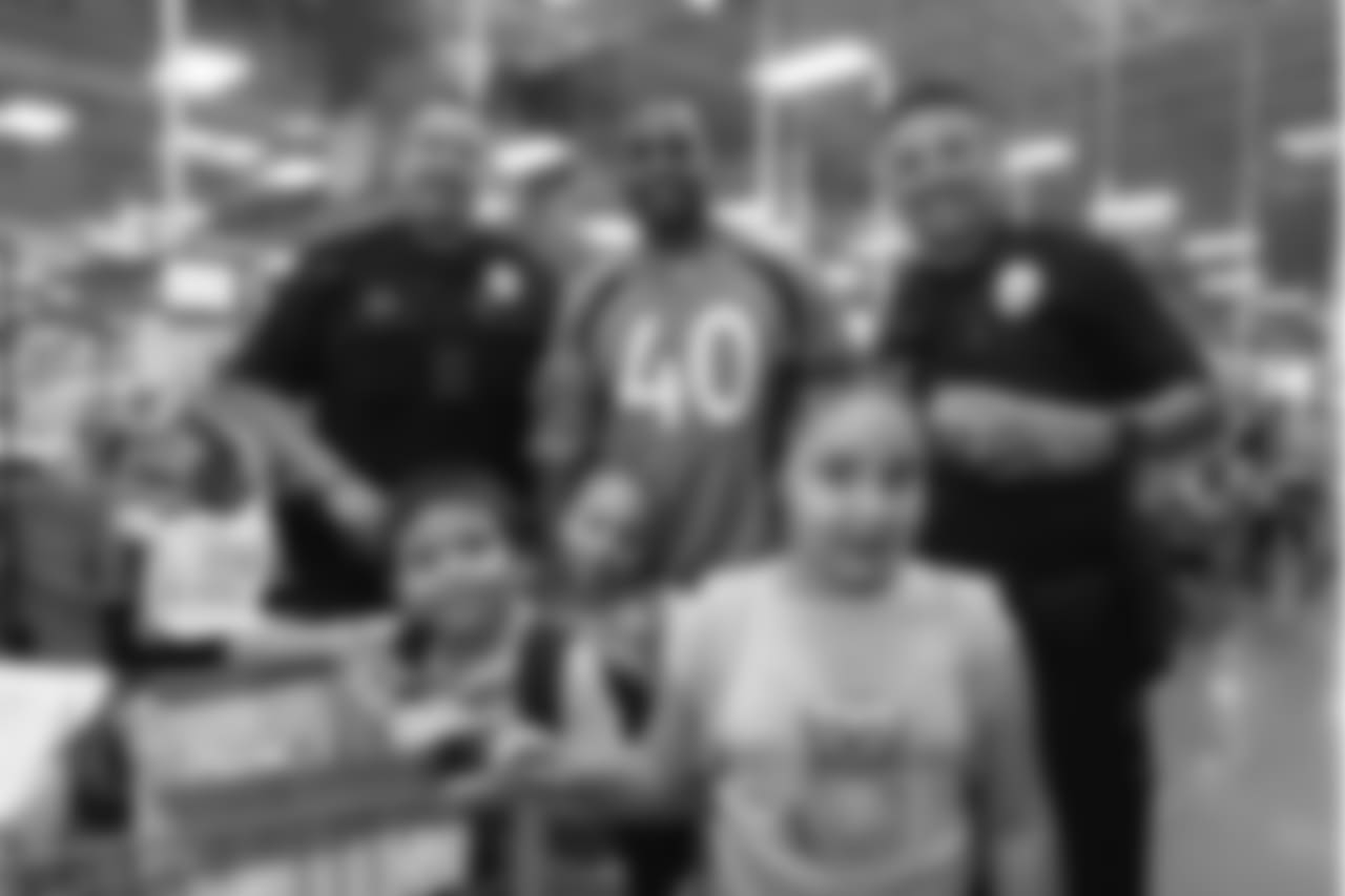 Inside linebacker Keishawn Bierria (40), two police officers and the children that Bierria took shopping at the 2018 Back to School with the Broncos shopping spree on July 23, 2018. Each student received $100 for school supplies.
