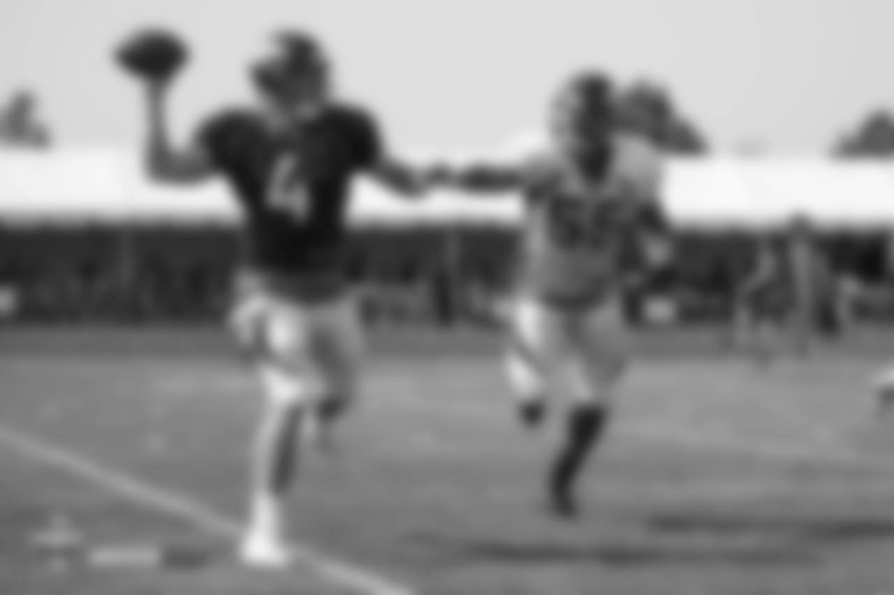 Quarterback Case Keenum (4) and outside linebacker Bradley Chubb (55) during the ninth day of training camp on August 7, 2018, at UCHealth Training Center.