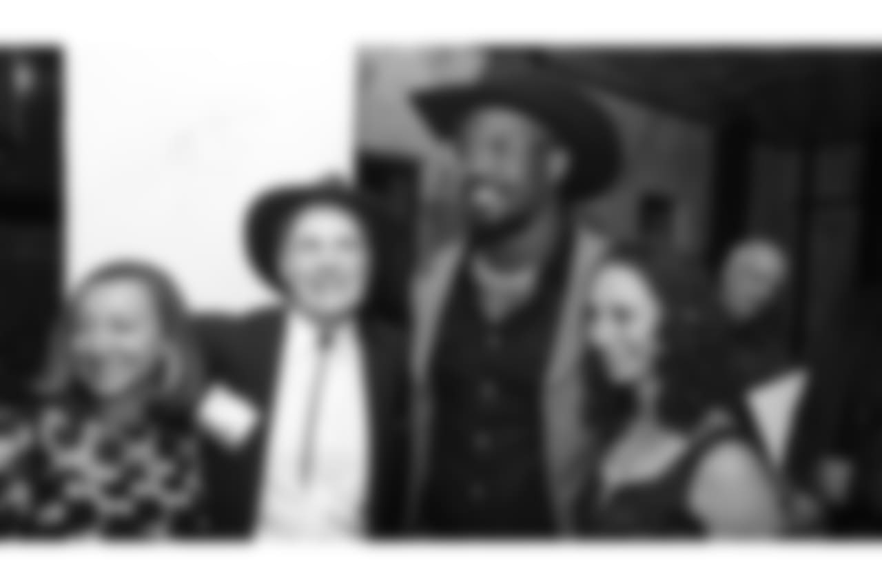 Von Miller poses with guests during Von's Vision at Mile High Station in Denver on November 5, 2018.