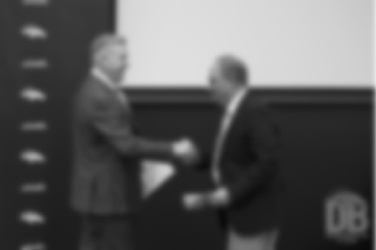 President of Football Operations/General Manager John Elway shakes hands with Head Coach Vic Fangio at his introductory press conference on January 10, 2019.
Photo by Gabriel Christus