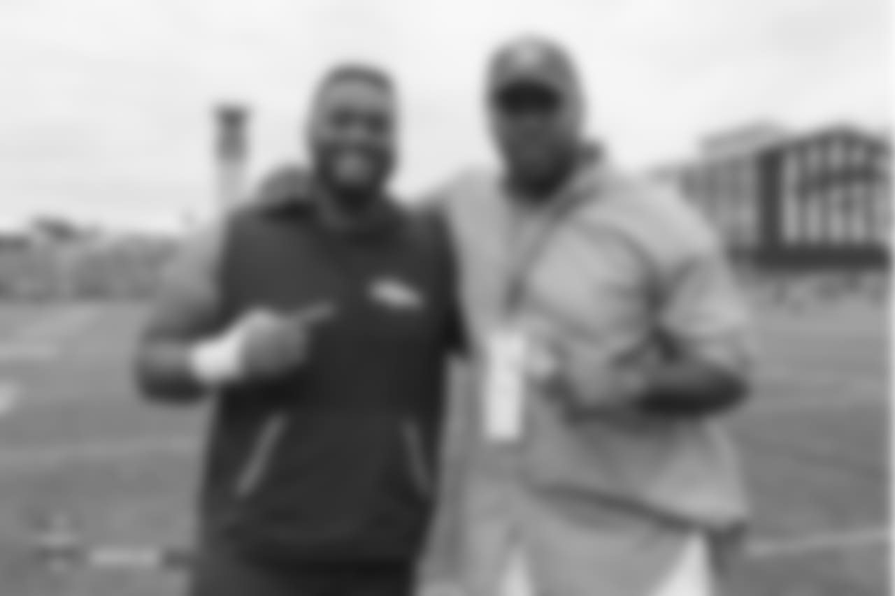 Defensive tackle Paul Boyette Jr. (91) and former Bronco Kevin Vickerson during the 10th day of training camp on August 8, 2018, at UCHealth Training Center.
