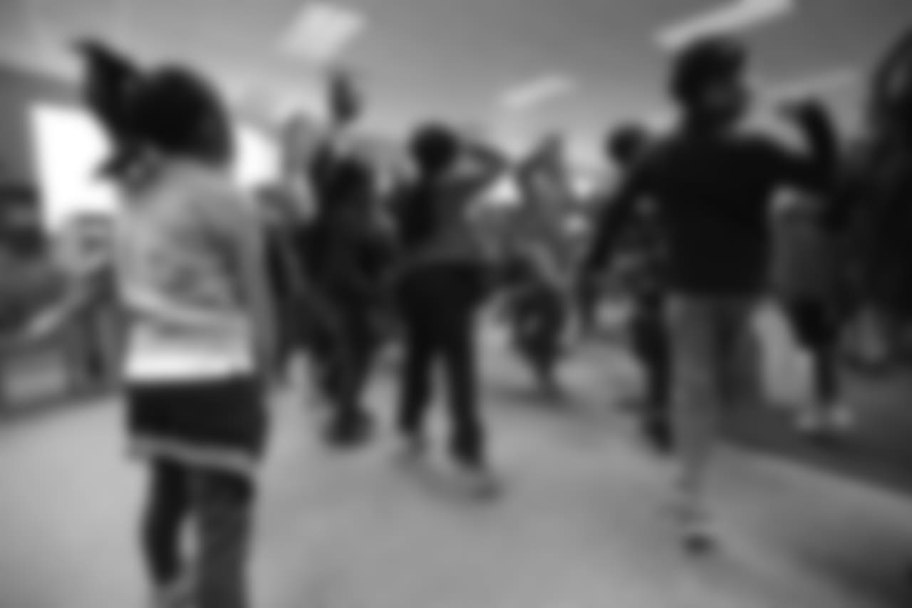 Courtland Sutton dances at a Playworks recess visit (alongside CarMax volunteers) with first-, second- and third-grade students at Greenwood Academy on October 9, 2018.