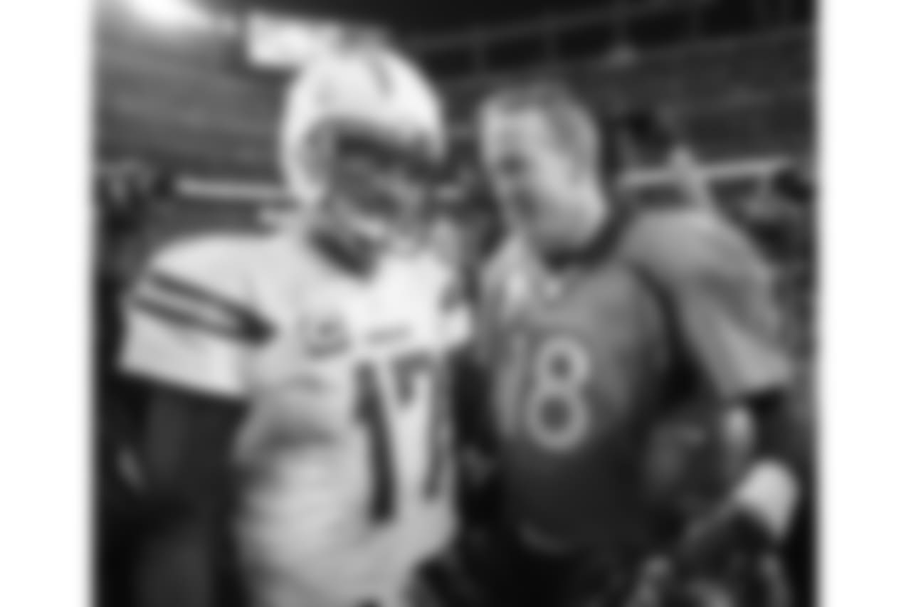 Peyton Manning (18) and San Diego Chargers quarterback Philip Rivers (17) talk after the game on Jan. 3, 2016.
