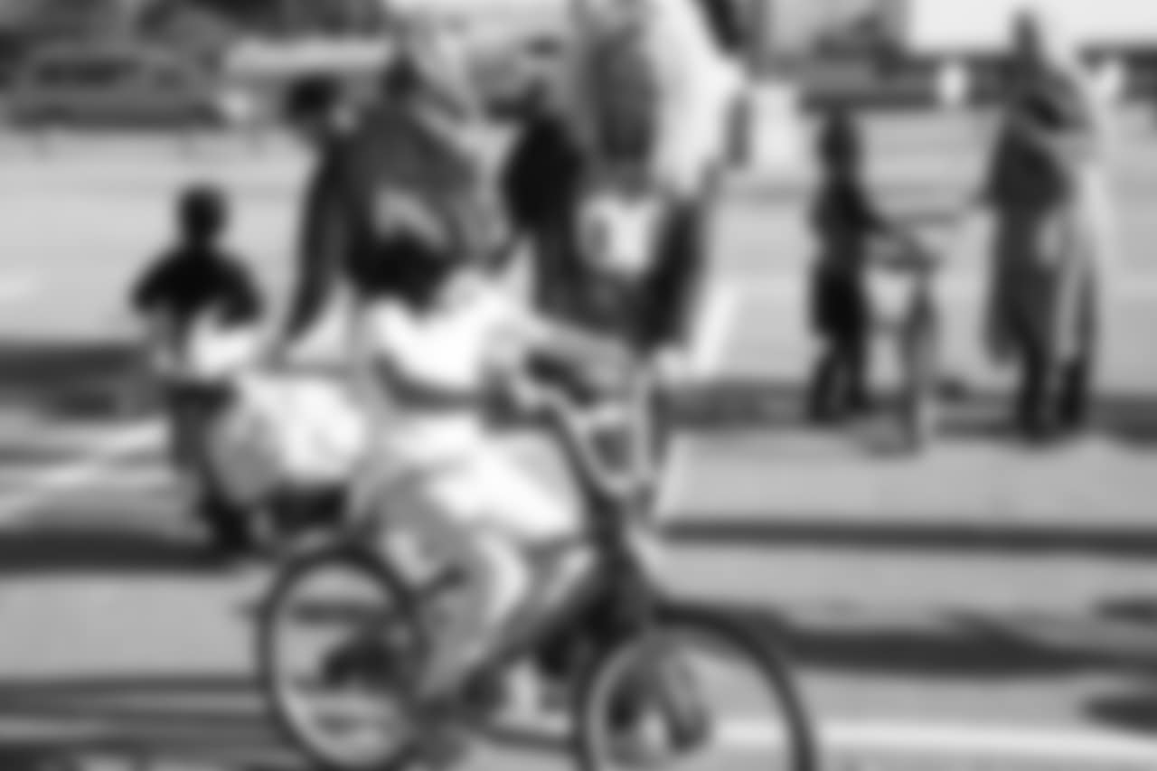 DBC Erica S. helps a bike rider during a bike distribution at Green Valley Elementary School in Denver on December 18, 2018.