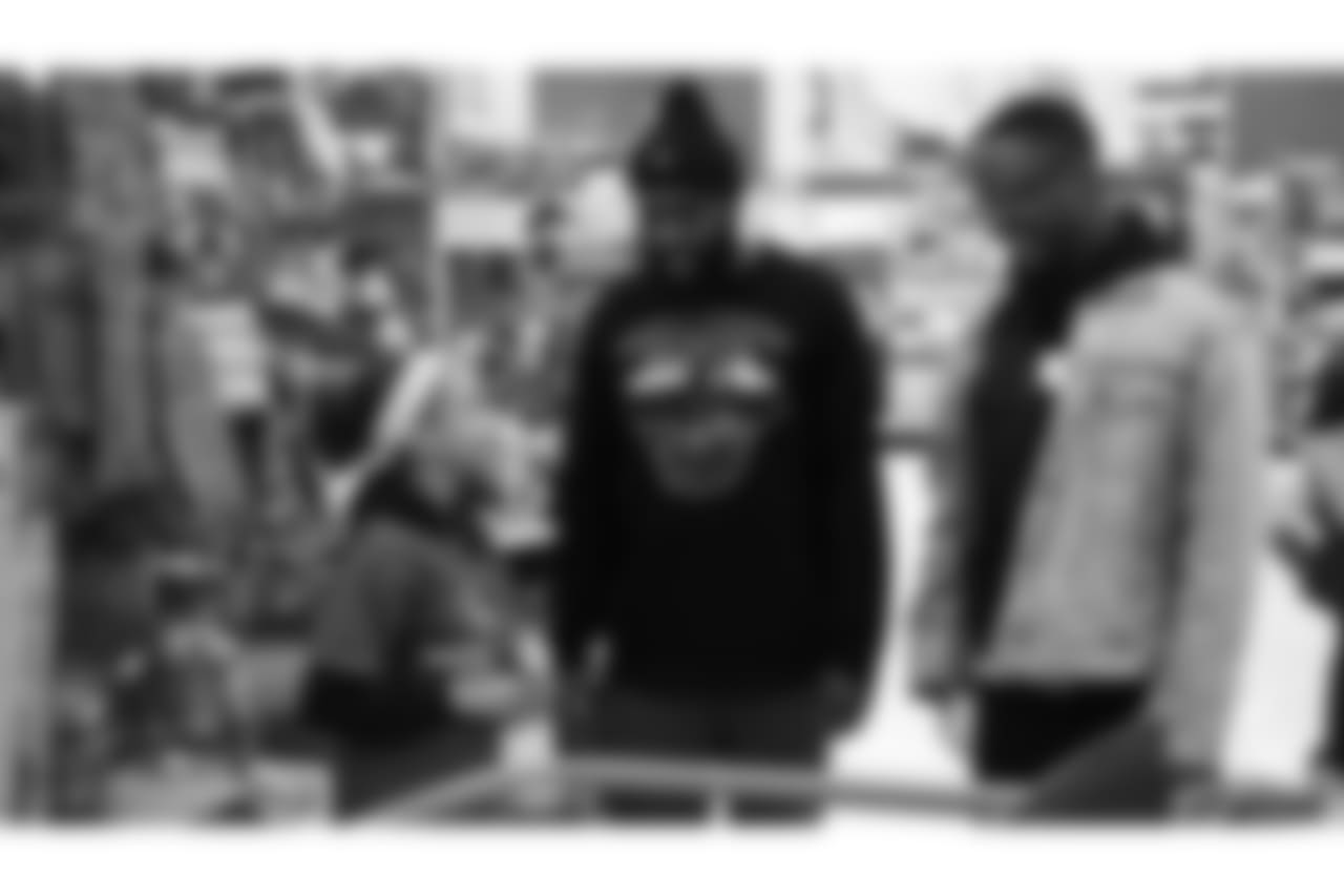 Darian Stewart and Will Parks talk with a participant during Will Parks' shopping spree for the Boys & Girls Club of Metro Denver on Dec. 3, 2018