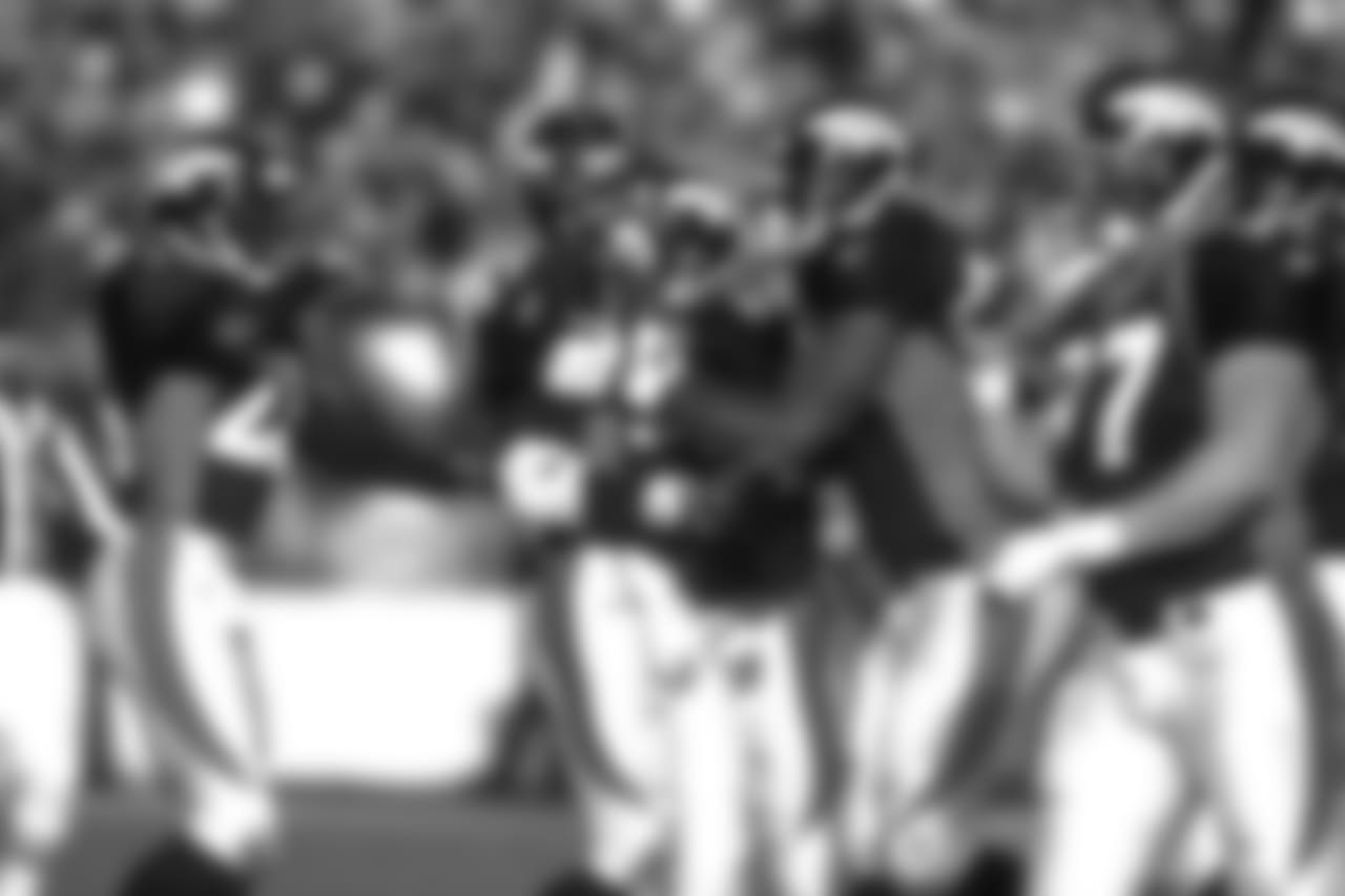 Denver: The Broncos defensive team celebrates Steve Atwater's interception against the Chargers against the San Diego Chargers at Mile High Stadium in Denver, CO on December 21, 1997.