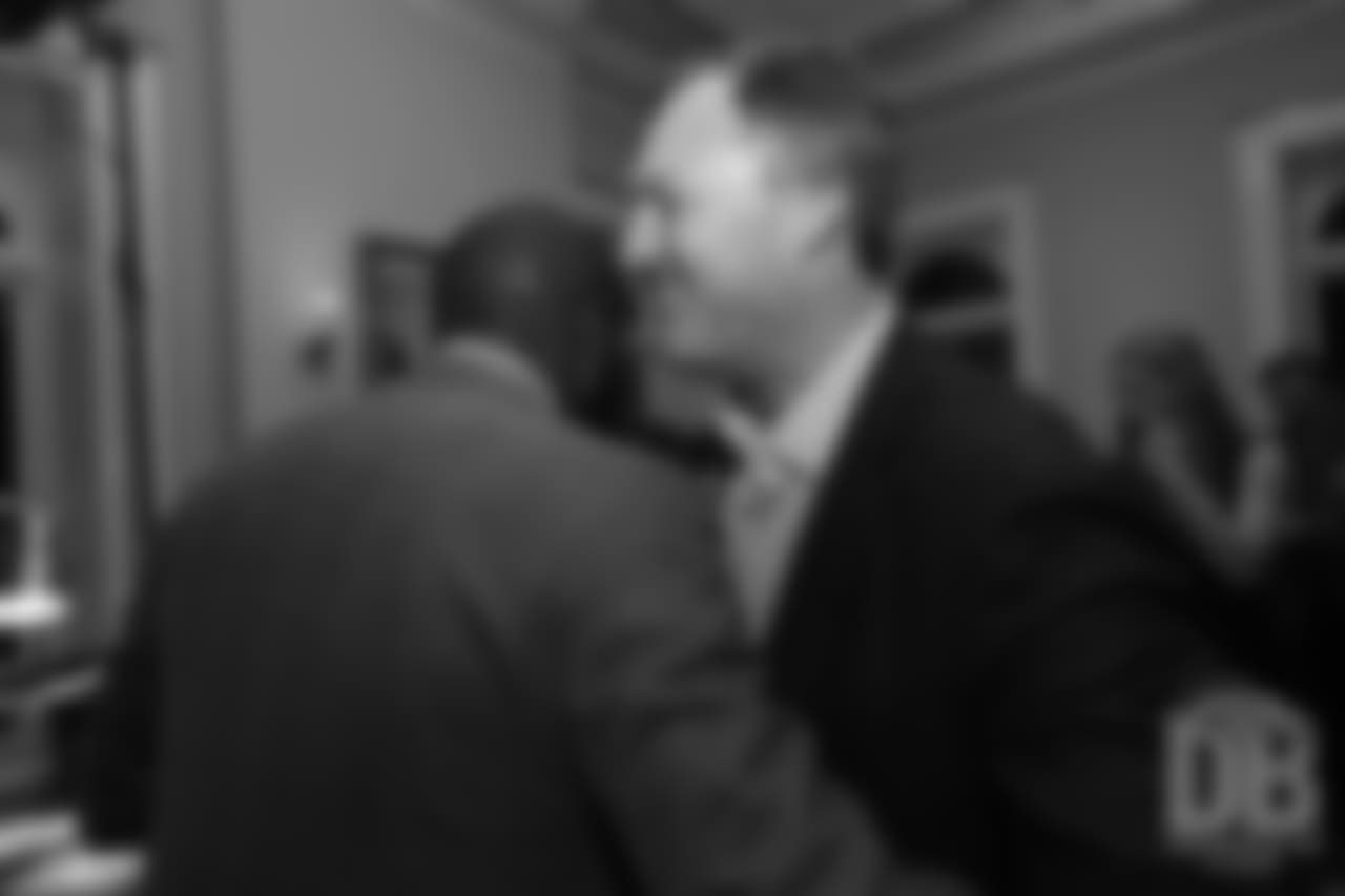 John Lynch greets Champ Bailey at the Pro Football Hall of Fame's Celebration of Excellence Reception in Atlanta on January 31, 2019.