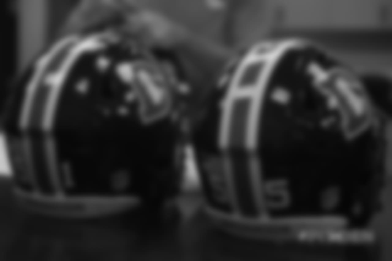 Inside the Broncos' equipment room as staffers transition helmets to the team's Color Rush set, applying new decals and throwback logos for the team's Week 12 game.
