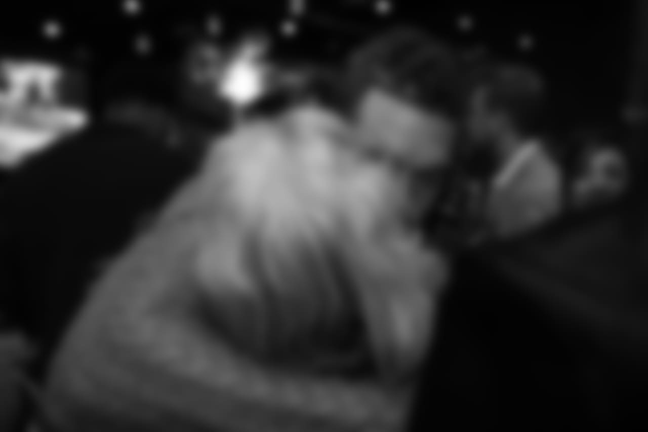 Derek Wolfe hugs a guest at Todd Davis' A+ Living Foundation Dinner on November 26, 2018.