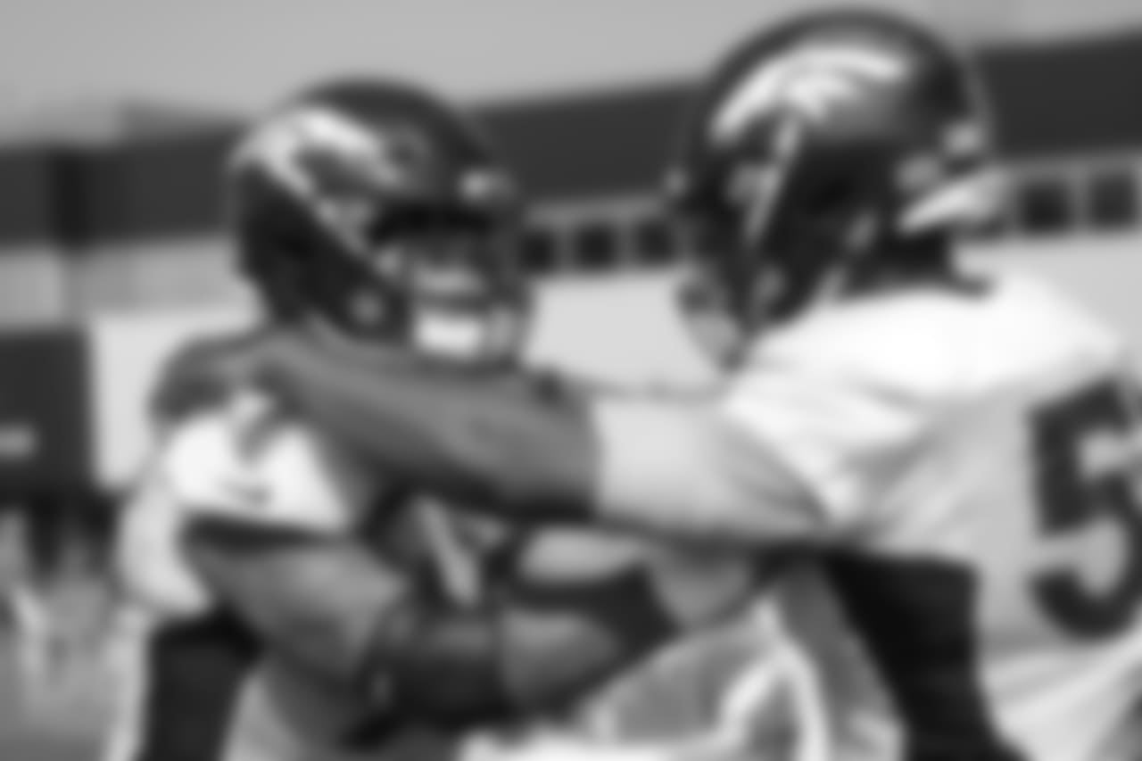 Defensive end Derek Wolfe (95) and defensive end DeMarcus Walker (57) during a practice at UCHealth Training Center on Aug. 13, 2018.