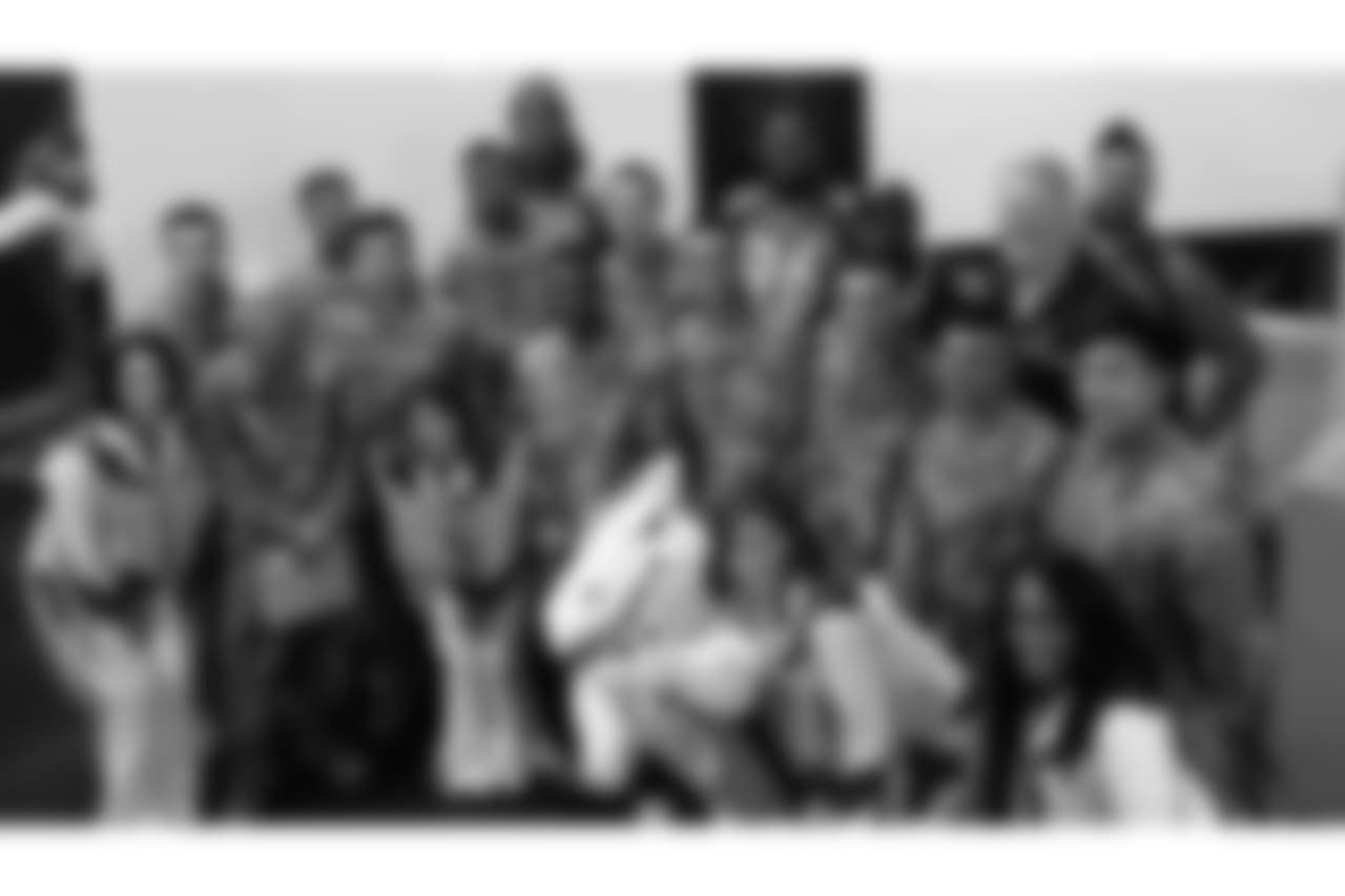 Players, cheerleaders, staffers and military members pose during the Denver Broncos' Salute To Service Caravan at Fort Carson, Colorado on October 30, 2018.