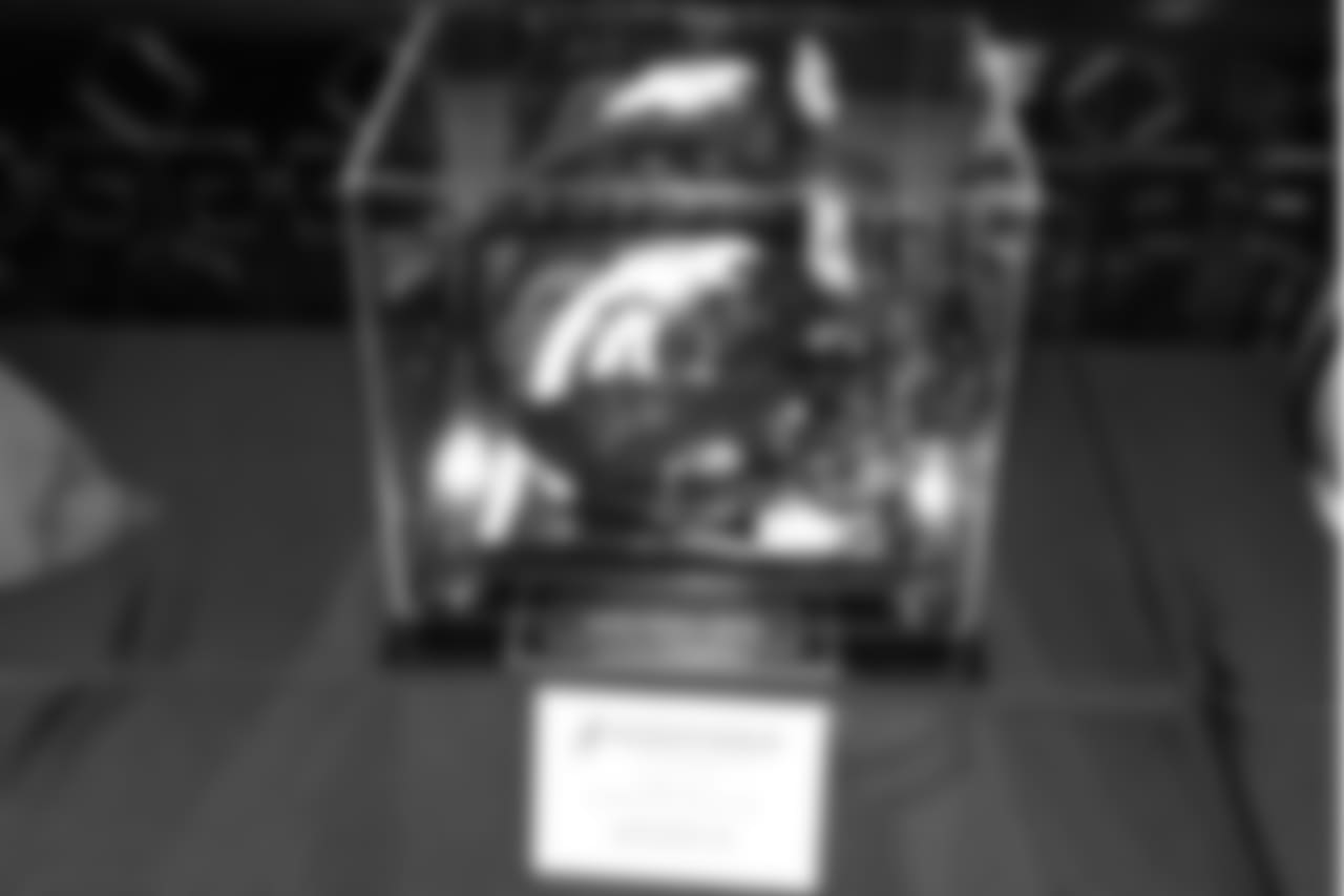 A helmet signed by Broncos greats on display during Von's Vision at Mile High Station in Denver on November 5, 2018.