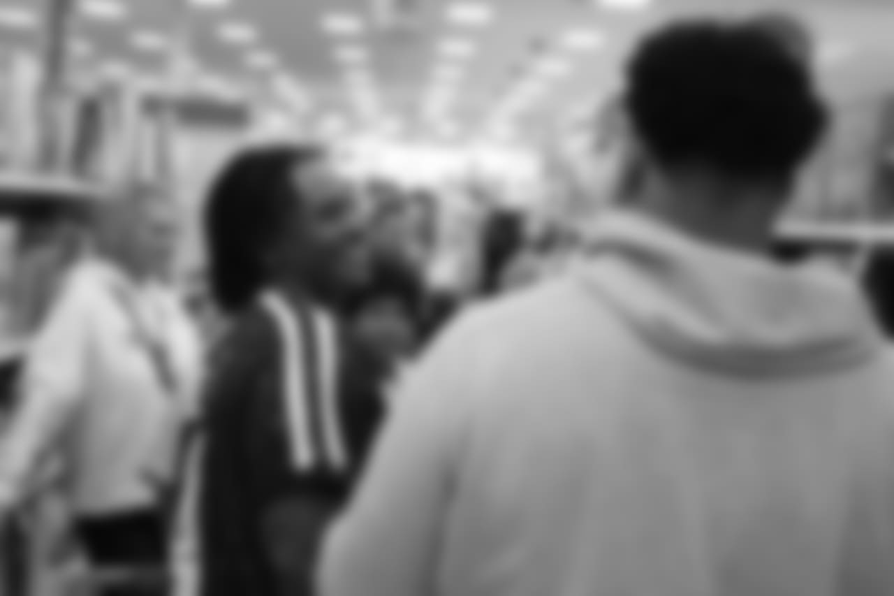 Todd Davis and Elijah Wilkinson share a laugh during Will Parks' shopping spree for the Boys & Girls Club of Metro Denver on Dec. 3, 2018