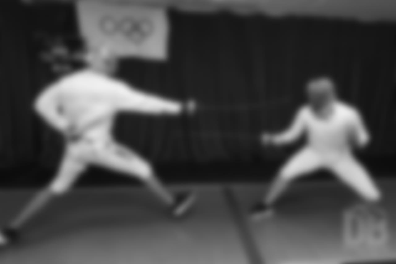 Brandon McManus and Casey Kreiter try their hands at fencing at the Denver Fencing Center on July 17, 2018.