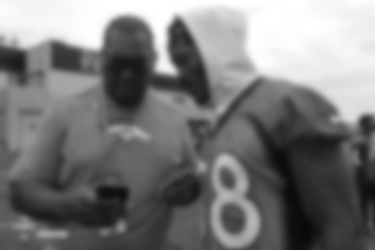 Wide receiver Demaryius Thomas (88) and former Bronco Orlando Franklin during the 10th day of training camp on August 8, 2018, at UCHealth Training Center.