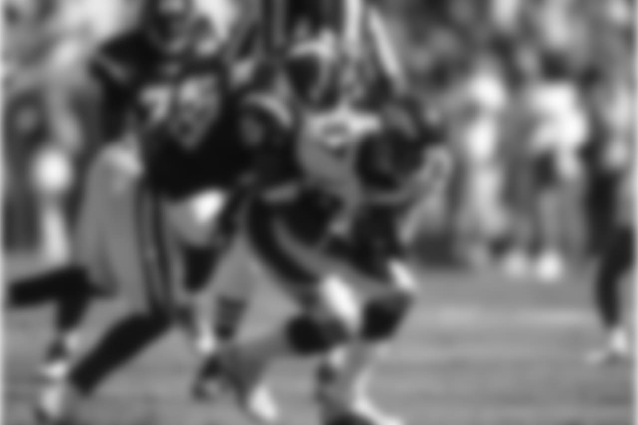 Ed McCaffrey makes a reception against the San Diego Chargers at Qualcomm Stadium in San Diego, CA on September 14, 2003.