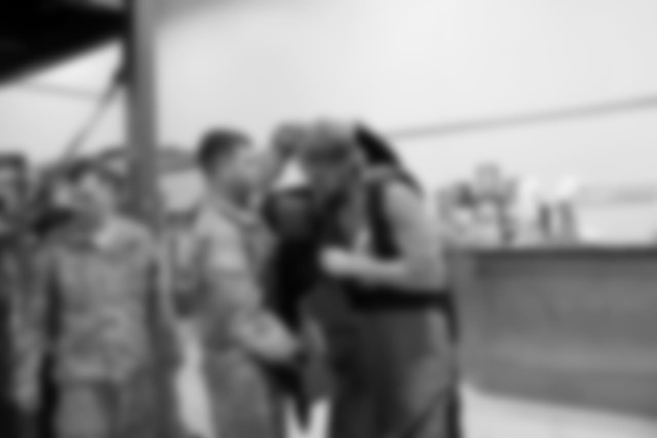 Aaron Brewer tries on a bomb suit with the 71st EOD (Explosive Ordinance Disposal) Company.