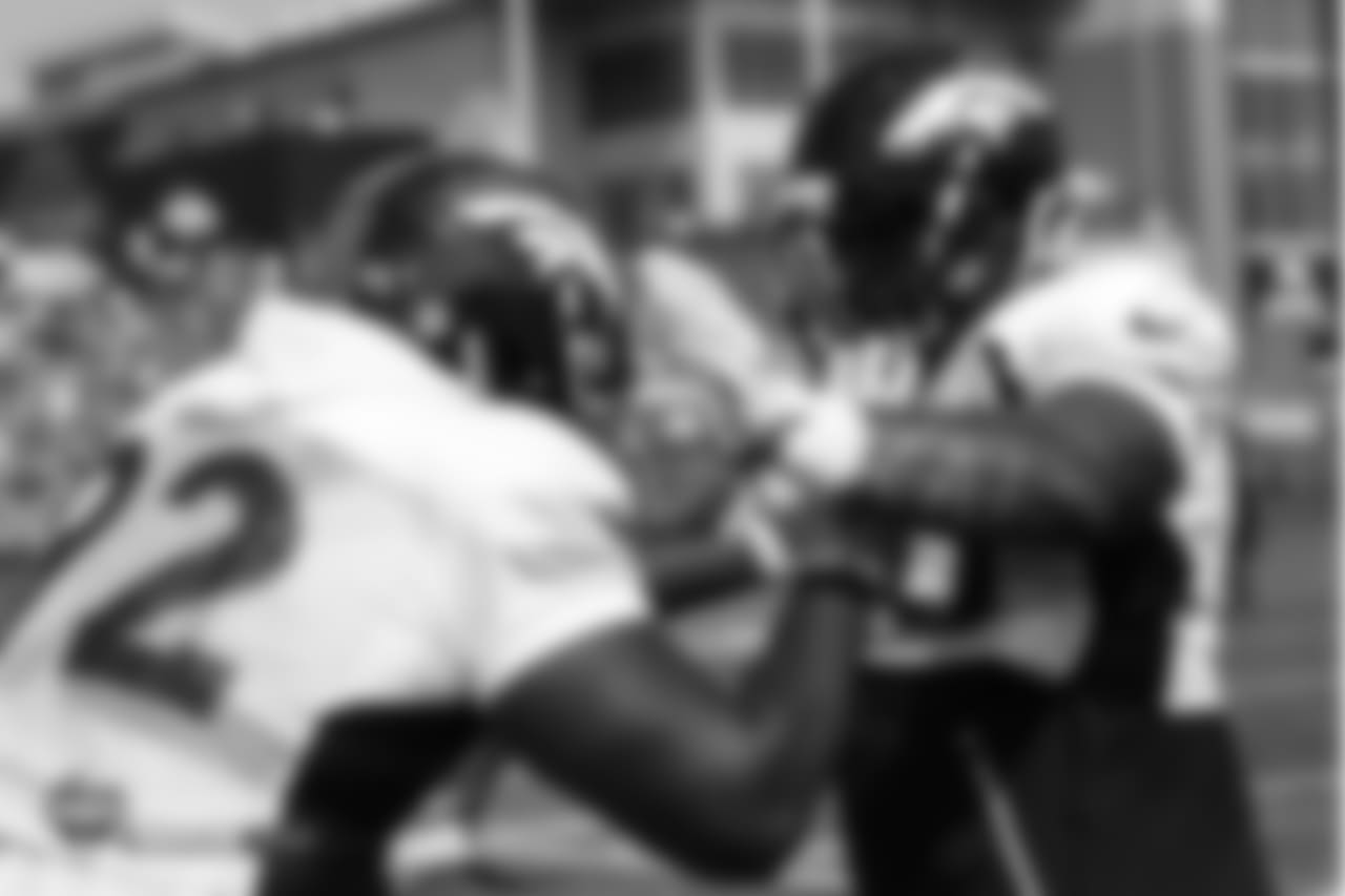 Defensive end Zach Kerr (92) and nose tackle Kyle Peko (90) during the ninth day of training camp on August 7, 2018, at UCHealth Training Center.