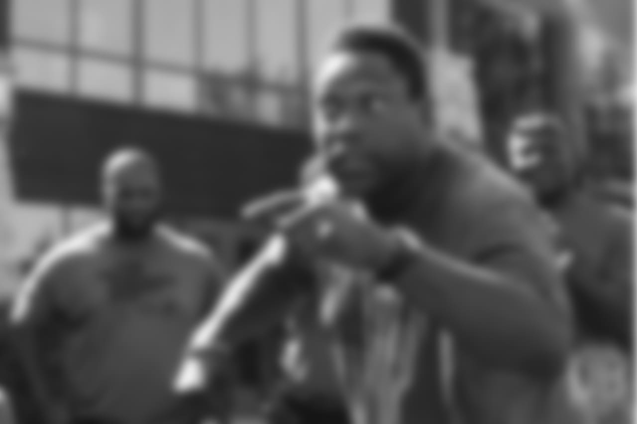 Warren Sapp talks to the group during the on-field portion of Von Miller's Pass Rush Summit, which included hands-on instruction and drills, on June 28, 2018.