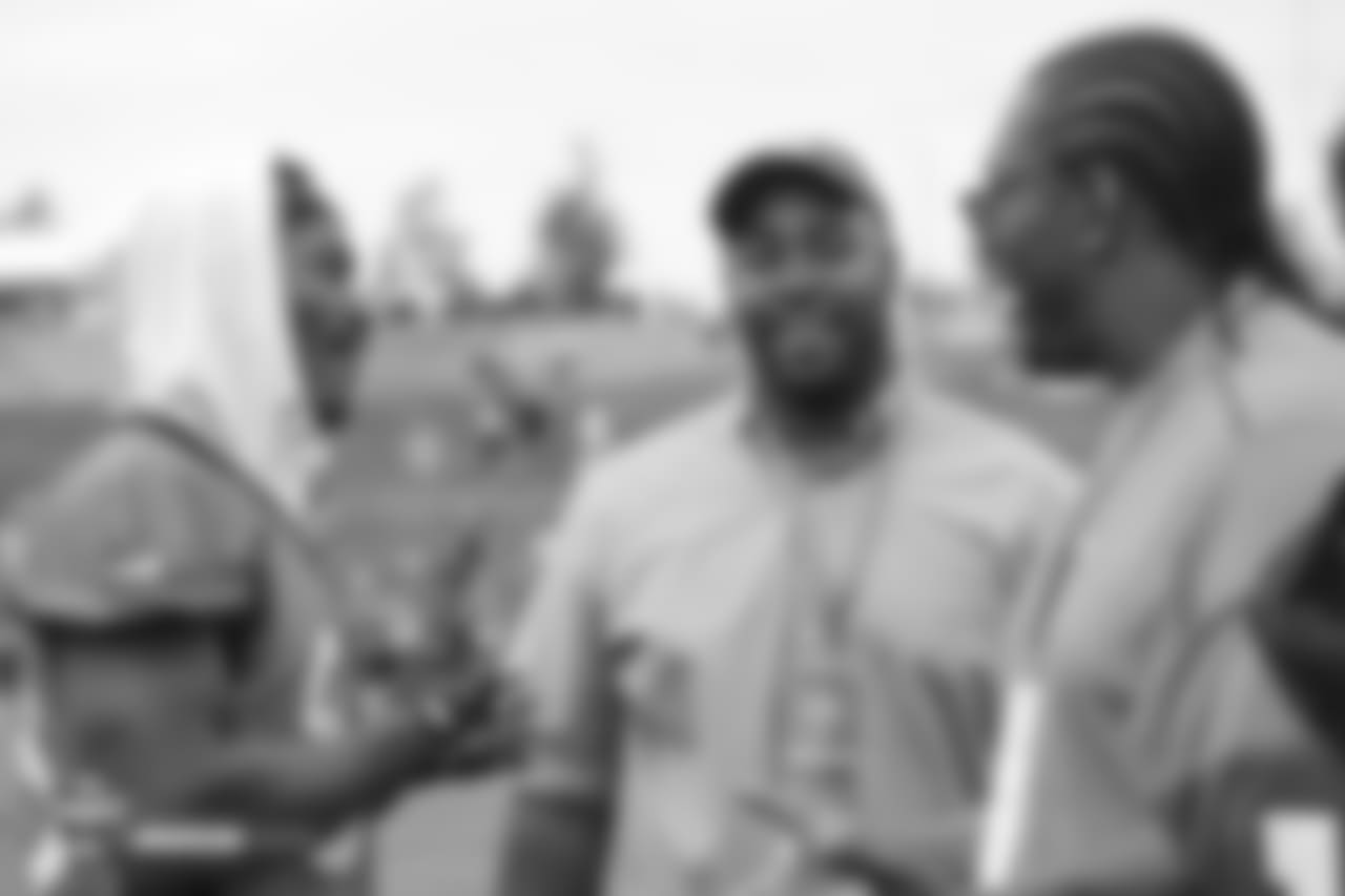 wide receiver Demaryius Thomas (88) talks with former Broncos Kevin Vickerson (center) and Orlando Franklin during the 10th day of training camp on August 8, 2018, at UCHealth Training Center.