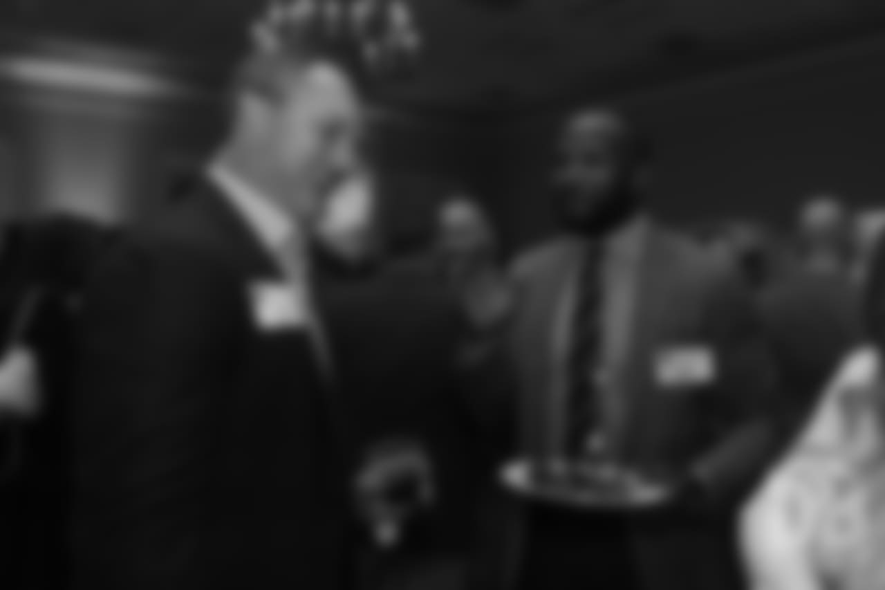 John Lynch greets Champ Bailey at the Pro Football Hall of Fame's Celebration of Excellence Reception in Atlanta on January 31, 2019.