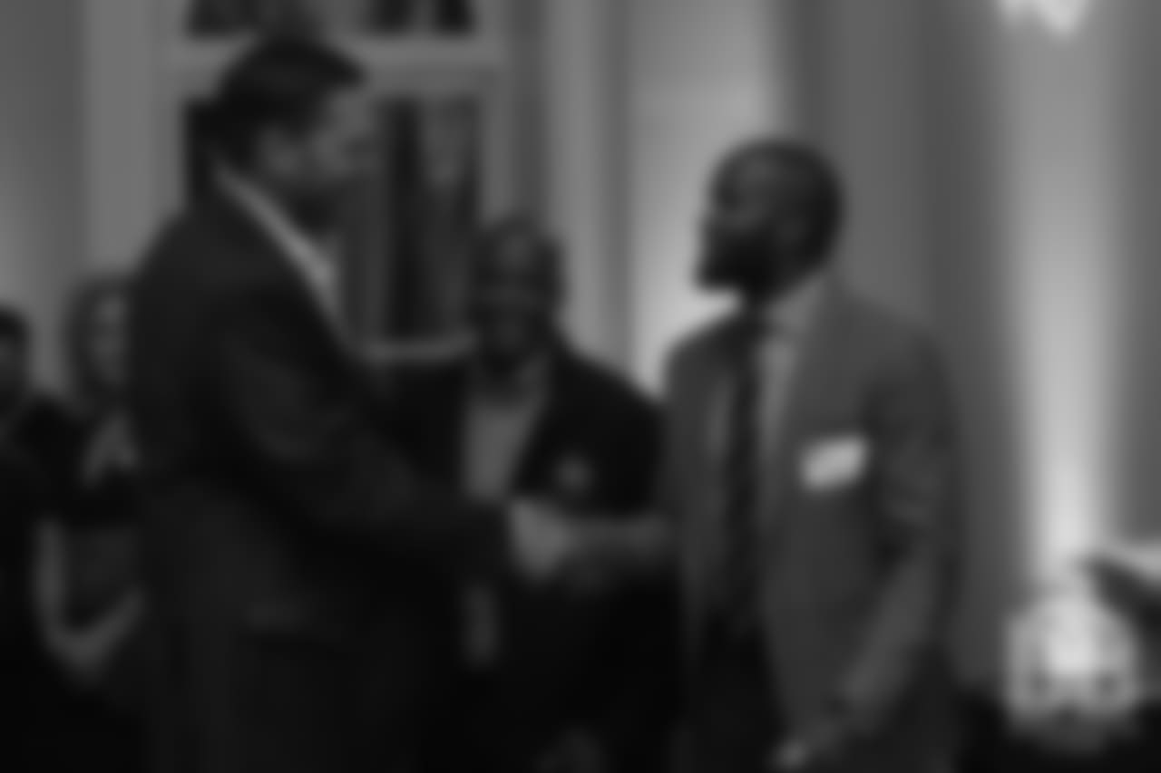 Hall of Fame finalists Champ Bailey and Tony Boselli shake hands at the Pro Football Hall of Fame's Celebration of Excellence Reception in Atlanta on January 31, 2019.