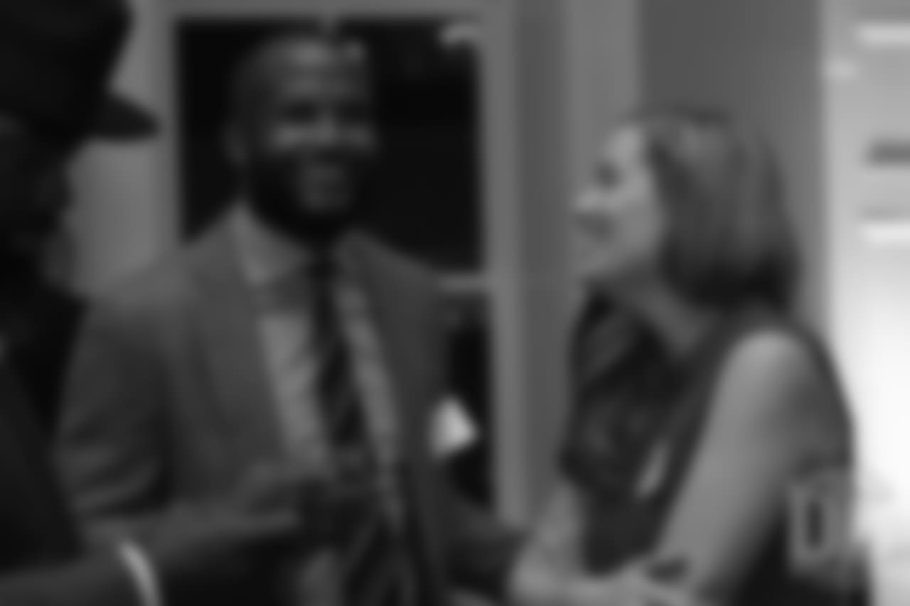 Brittany Bowlen talks with Champ Bailey at the Pro Football Hall of Fame's Celebration of Excellence Reception in Atlanta on January 31, 2019.