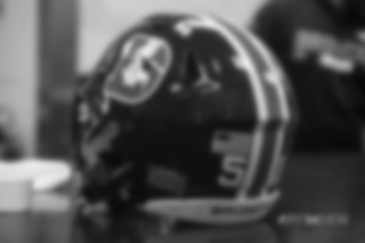 Inside the Broncos' equipment room as staffers transition helmets to the team's Color Rush set, applying new decals and throwback logos for the team's Week 12 game.