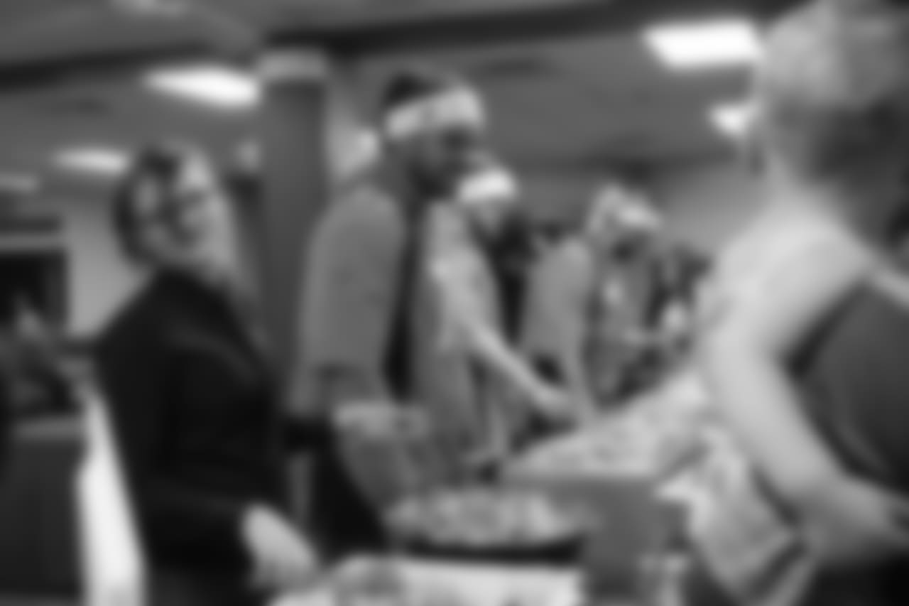 Nico Falah serves dinner at the Denver Rescue Mission's 19th annual holiday party.