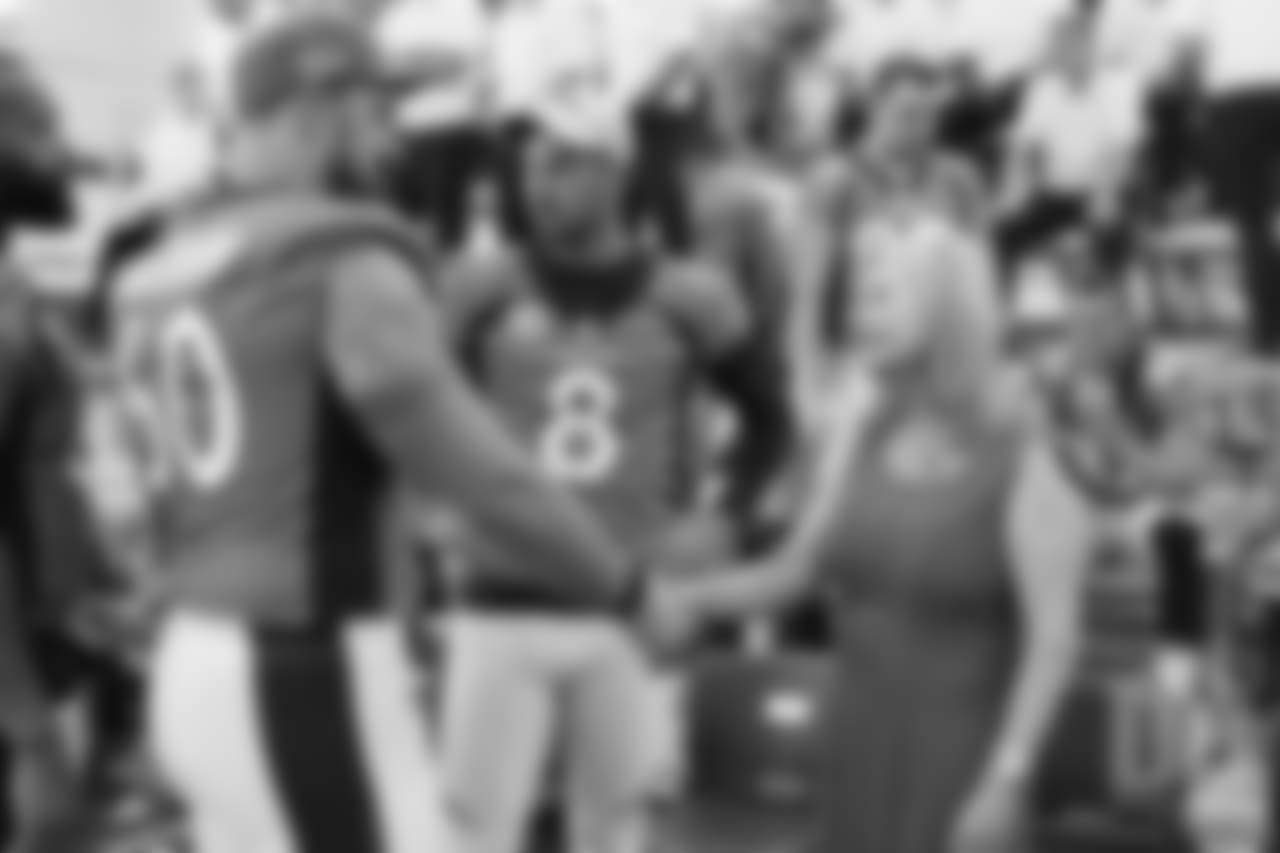 Connor McGovern greets Annabel Bowlen at team photo day at UCHealth Training Center on September 15, 2018.