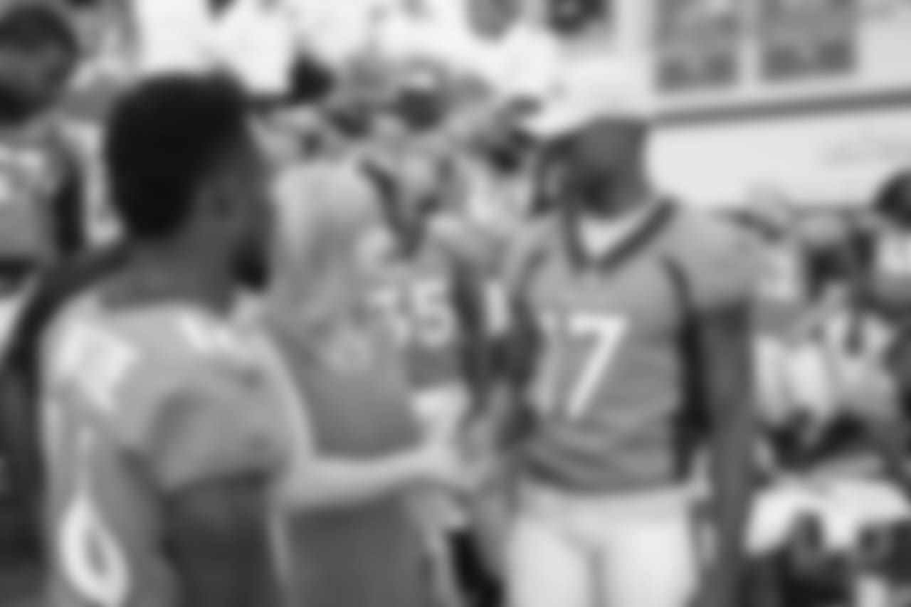 DaeSean Hamilton greets Annabel Bowlen at team photo day at UCHealth Training Center on September 15, 2018.