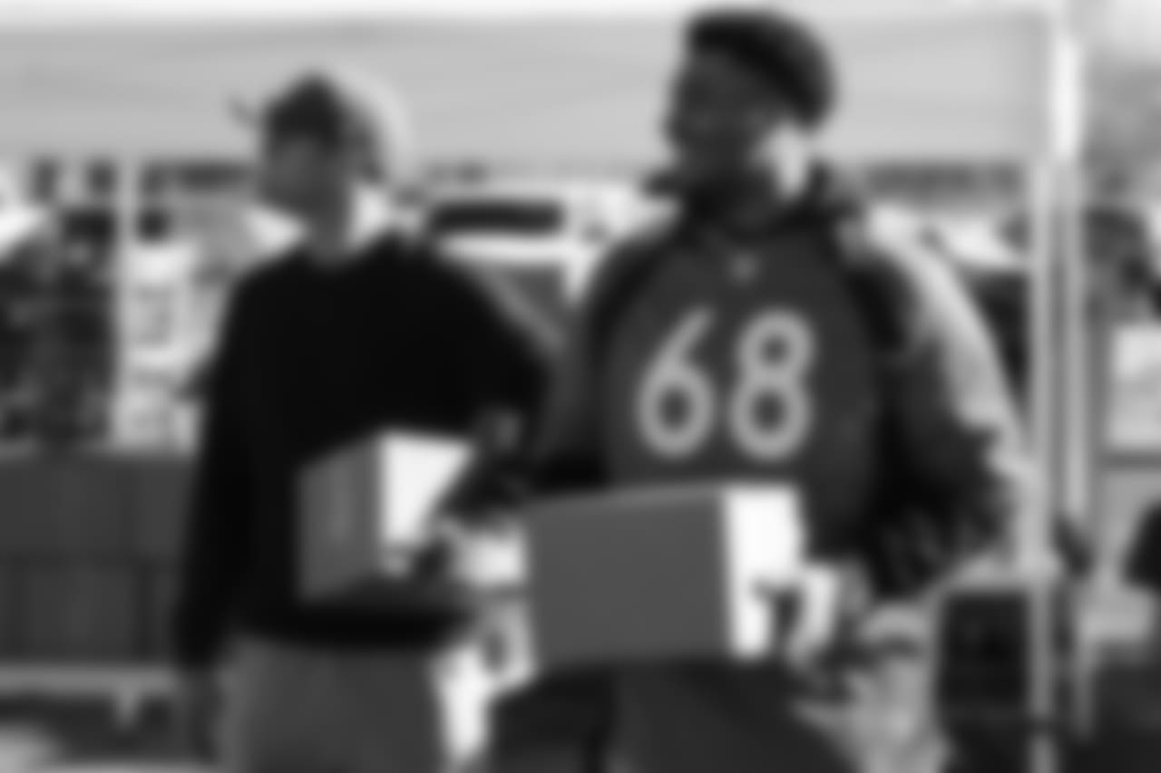 (From left) Kevin Hogan and Elijah Wilkinson during the Denver Rescue Mission's Thanksgiving Turkey in a Box distribution on Nov. 20, 2018