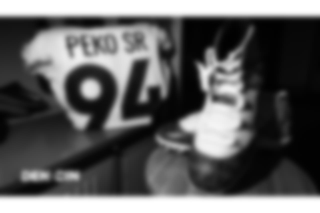 Domata Peko Sr.'s jersey and My Cause My Cleats shoes in the locker room pregame before the Broncos' Week 13 game against the Cincinnati Bengals at Paul Brown Stadium.