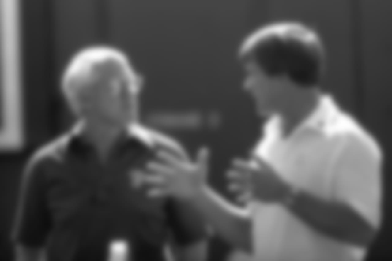 San Francisco head coach Bill Walsh talks with Broncos head coach Dan Reeves before a September 19, 1982 win (24-21) over the 49ers at Mile High Stadium.