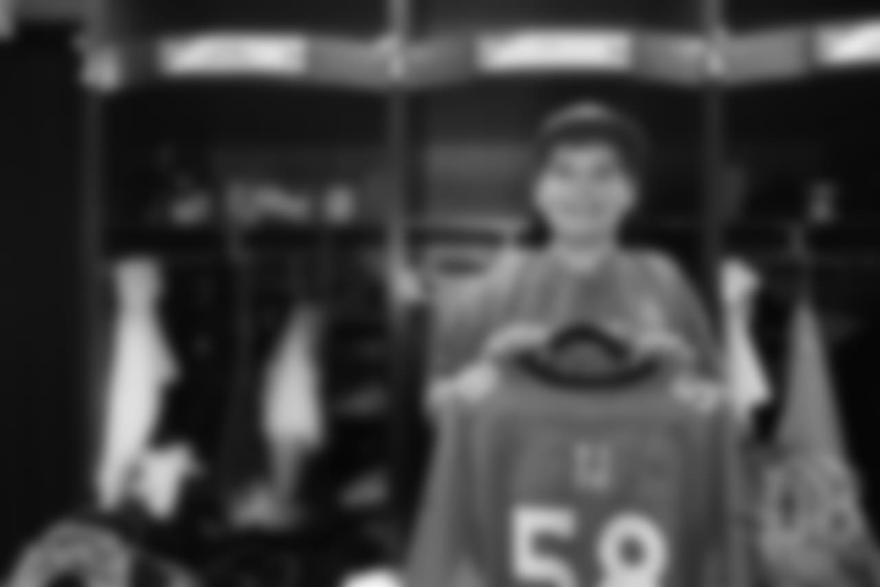 TJ, a 12-year-old fighting cystic fibrosis, wanted to be Von Miller for a day, and the Make-A-Wish Foundation helped make that dream come true on September 29, 2018. Here, he poses in front of his locker with his custom jersey next to Miller's locker.
