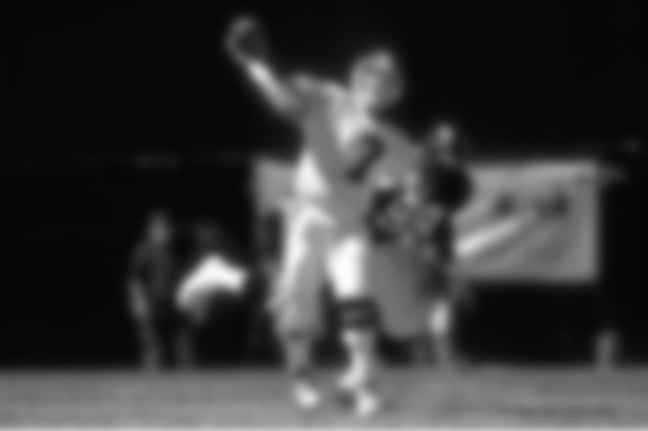 John Elway passes against the San Diego Chargers.