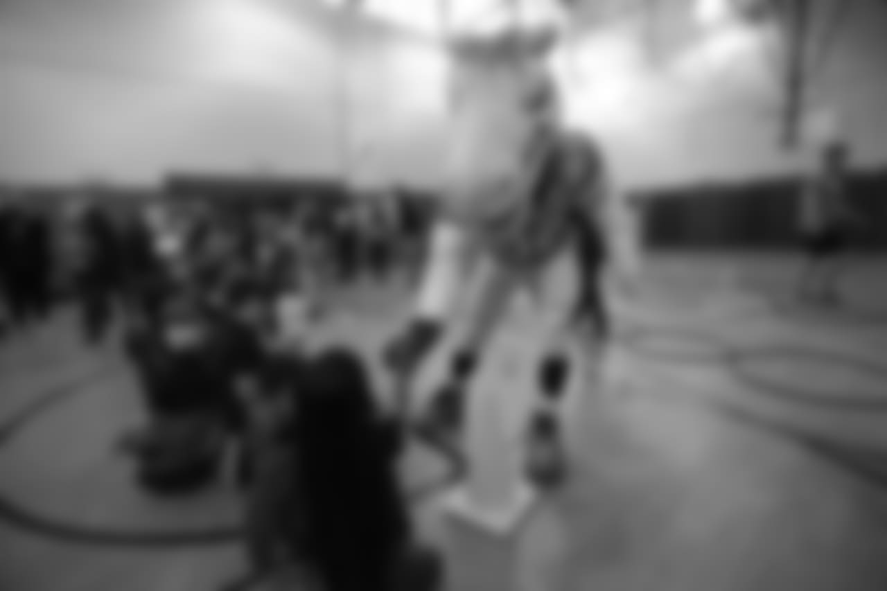 Miles the mascot gives high-fives at a Playworks recess visit (alongside CarMax volunteers) with first-, second- and third-grade students at Greenwood Academy on October 9, 2018.