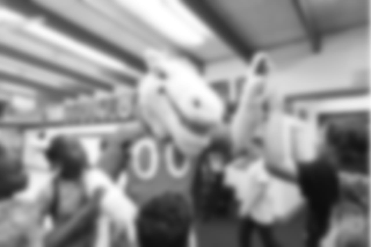 Miles the mascot high-fives children at the Denver Broncos Boys & Girls Club at the Broncos' third annual Rookie Community Service Day on June 11, 2018.