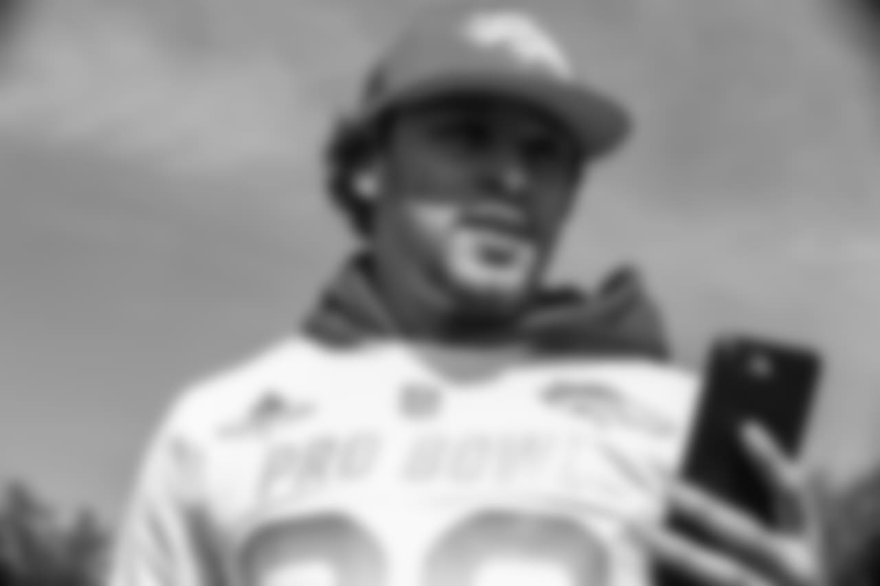 Phillip Lindsay checks his phone at the final day of Pro Bowl practice and photo day at the ESPN Wide World of Sports Complex on January 25, 2019, in Orlando, Florida.