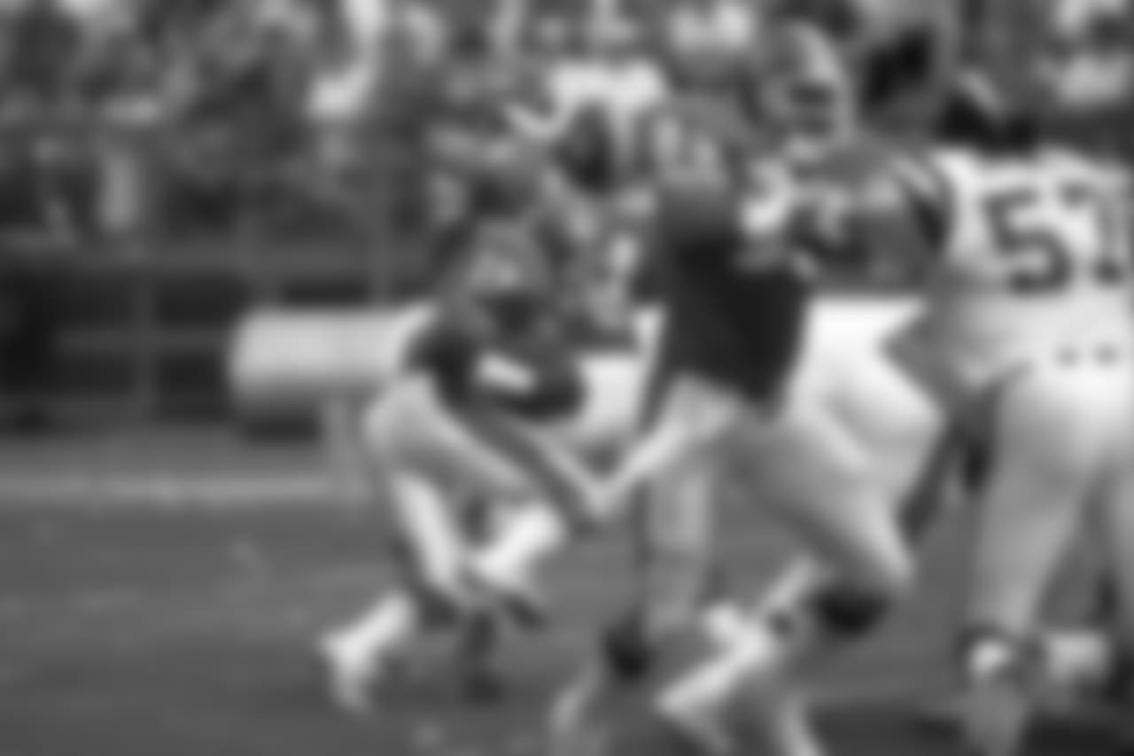 Tony Dorsett maneuvers behind the Broncos line looking for a hole in the Chargers defense.