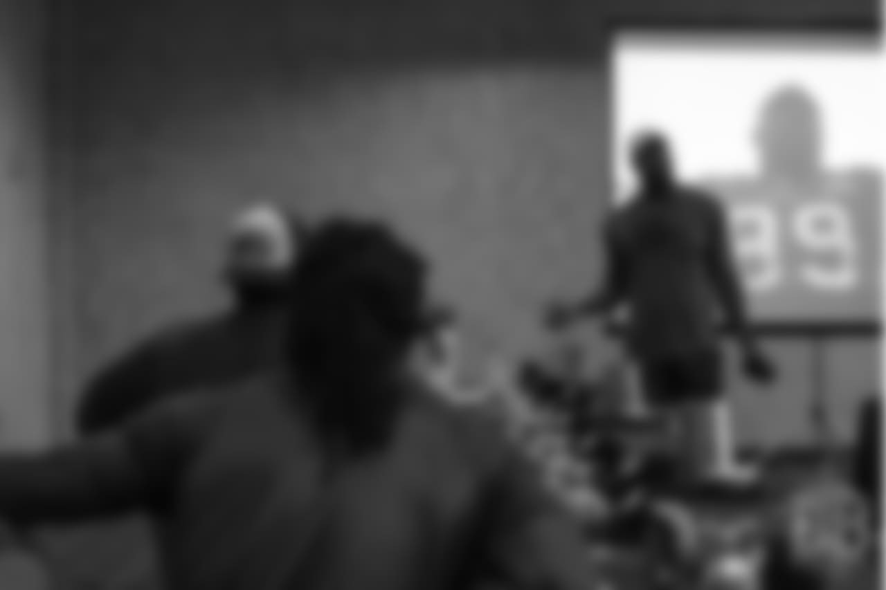 Von Miller reviews player film at Von Miller's Pass Rush Summit, which included hands-on instruction and drills, on June 28, 2018.