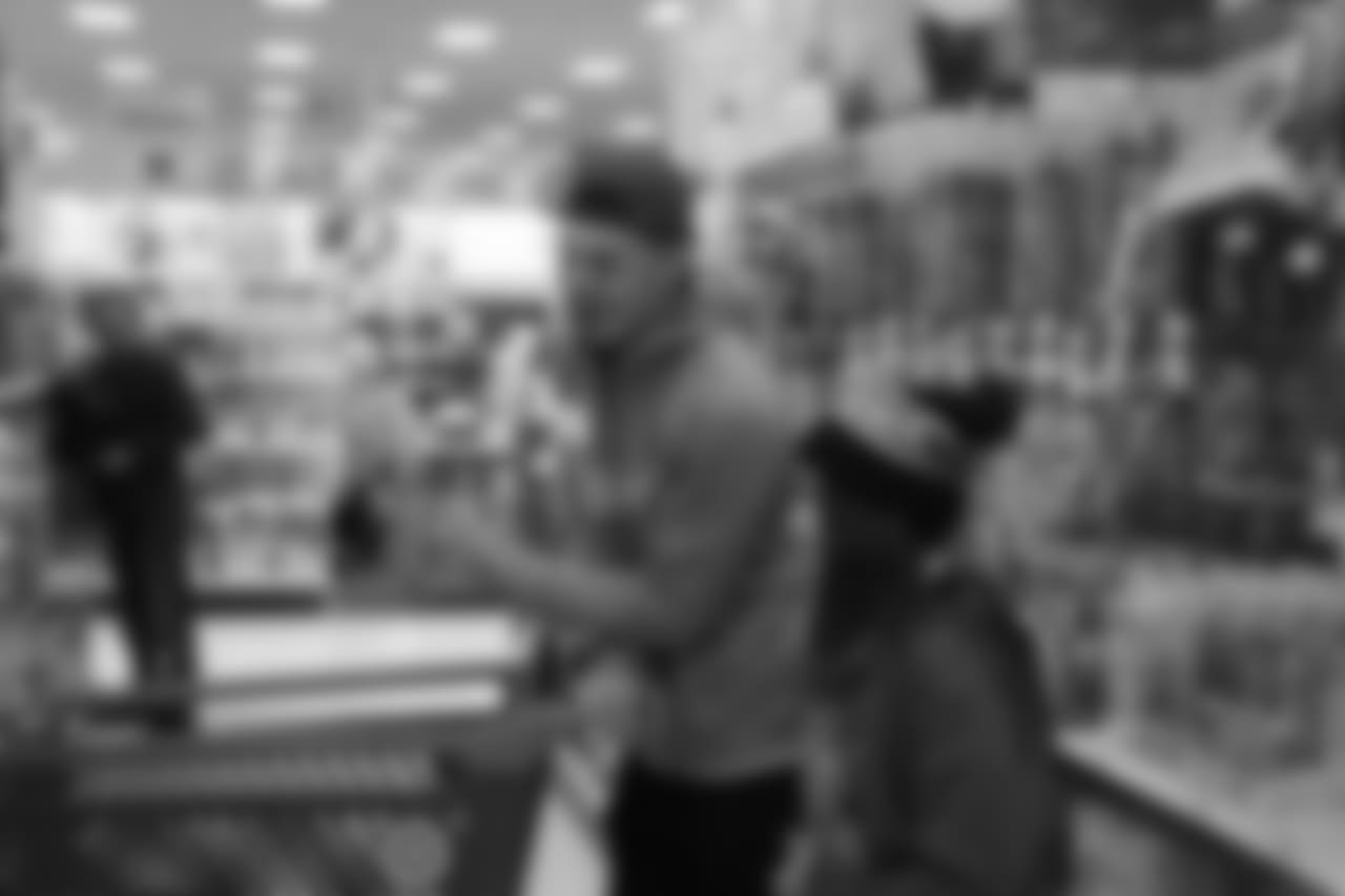 Justin Simmons helps pick out toys during Will Parks' shopping spree for the Boys & Girls Club of Metro Denver on Dec. 3, 2018