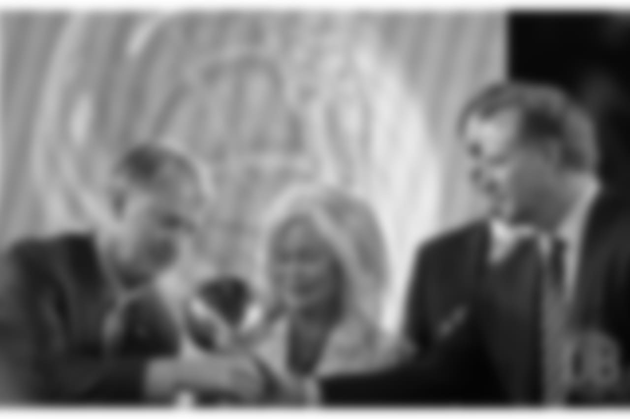 Annabel Bowlen and Joe Ellis receive the Lombardi Trophy from NFL Commissioner Roger Goodell on the awards stage after the Broncos defeated the Panthers on Feb. 7, 2016.