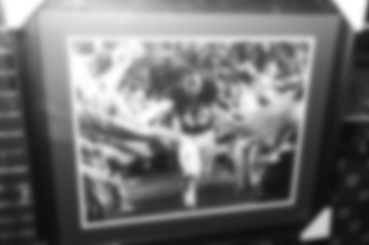 A framed Von Miller picture from his time at Texas A&M on display during Von's Vision at Mile High Station in Denver on November 5, 2018.
