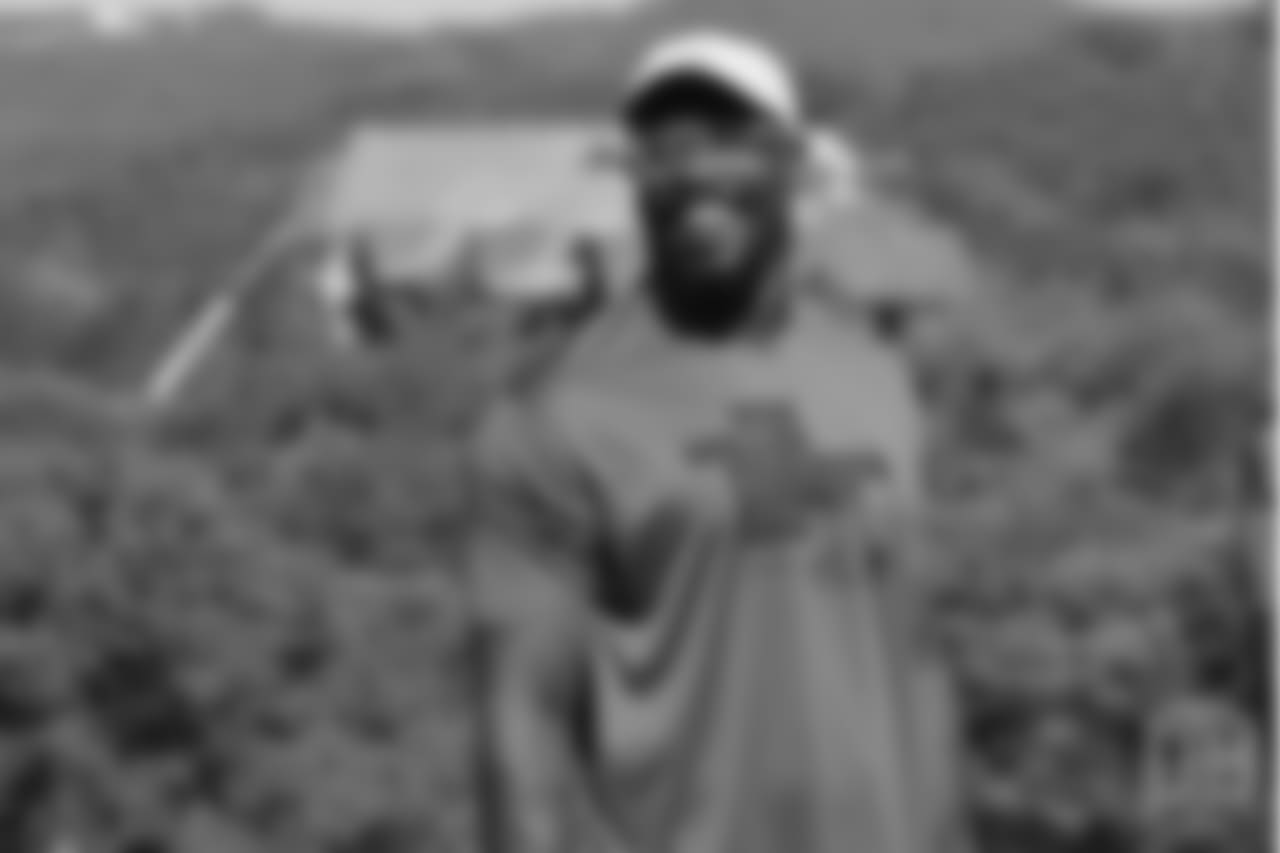 Von Miller smiles at the on-field portion of Von Miller's Pass Rush Summit, which included hands-on instruction and drills, on June 28, 2018.