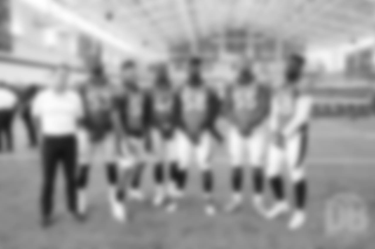 A group photo of outside linebackers (from left to right) Deiontrez Mount, Shane Ray, Jeff Holland, Von Miller, Bradley Chubb, Shaquil Barrett and, at far left, Assistant Defensive Line Coach Chris Beake at team photo day at UCHealth Training Center on September 15, 2018.