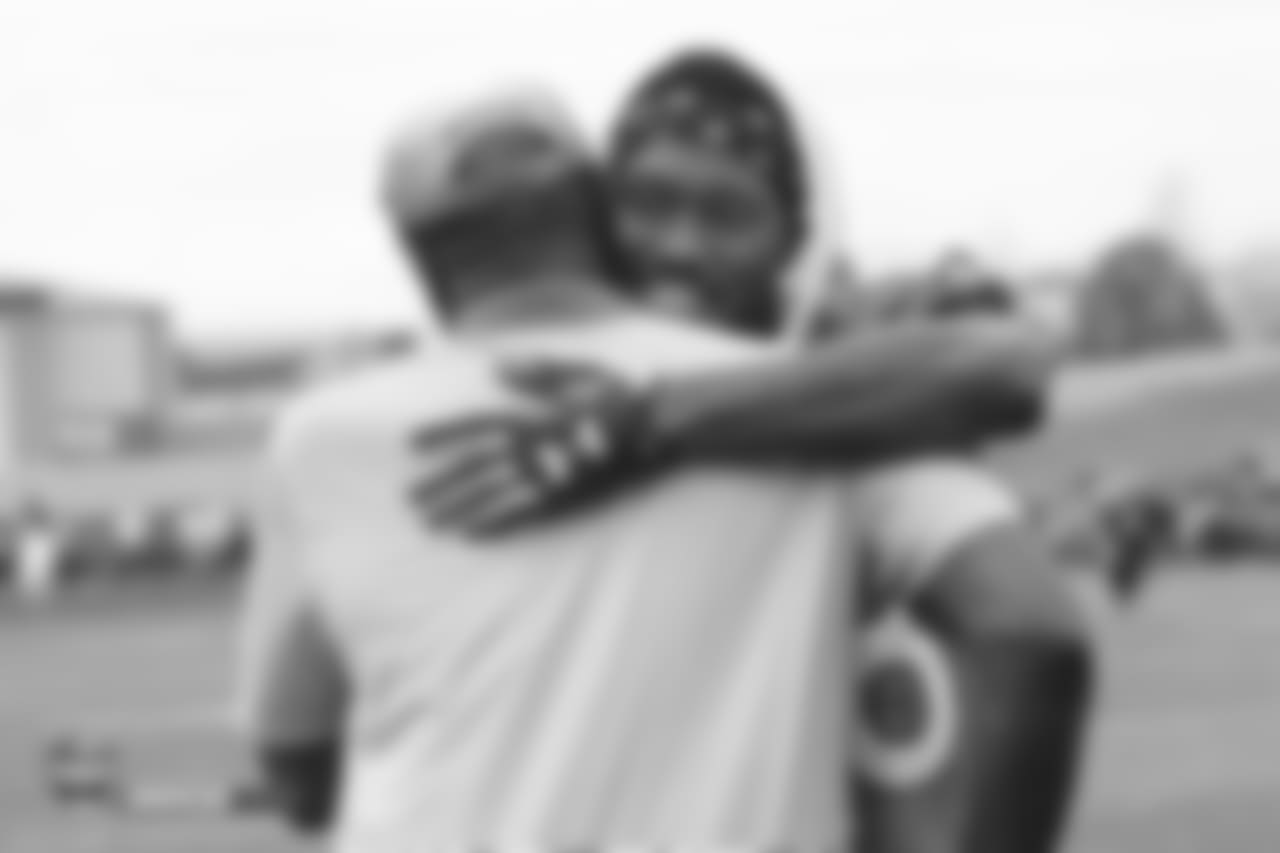 Wide receiver Demaryius Thomas (88) greets a Broncos alumnus during the 10th day of training camp on August 8, 2018, at UCHealth Training Center.
