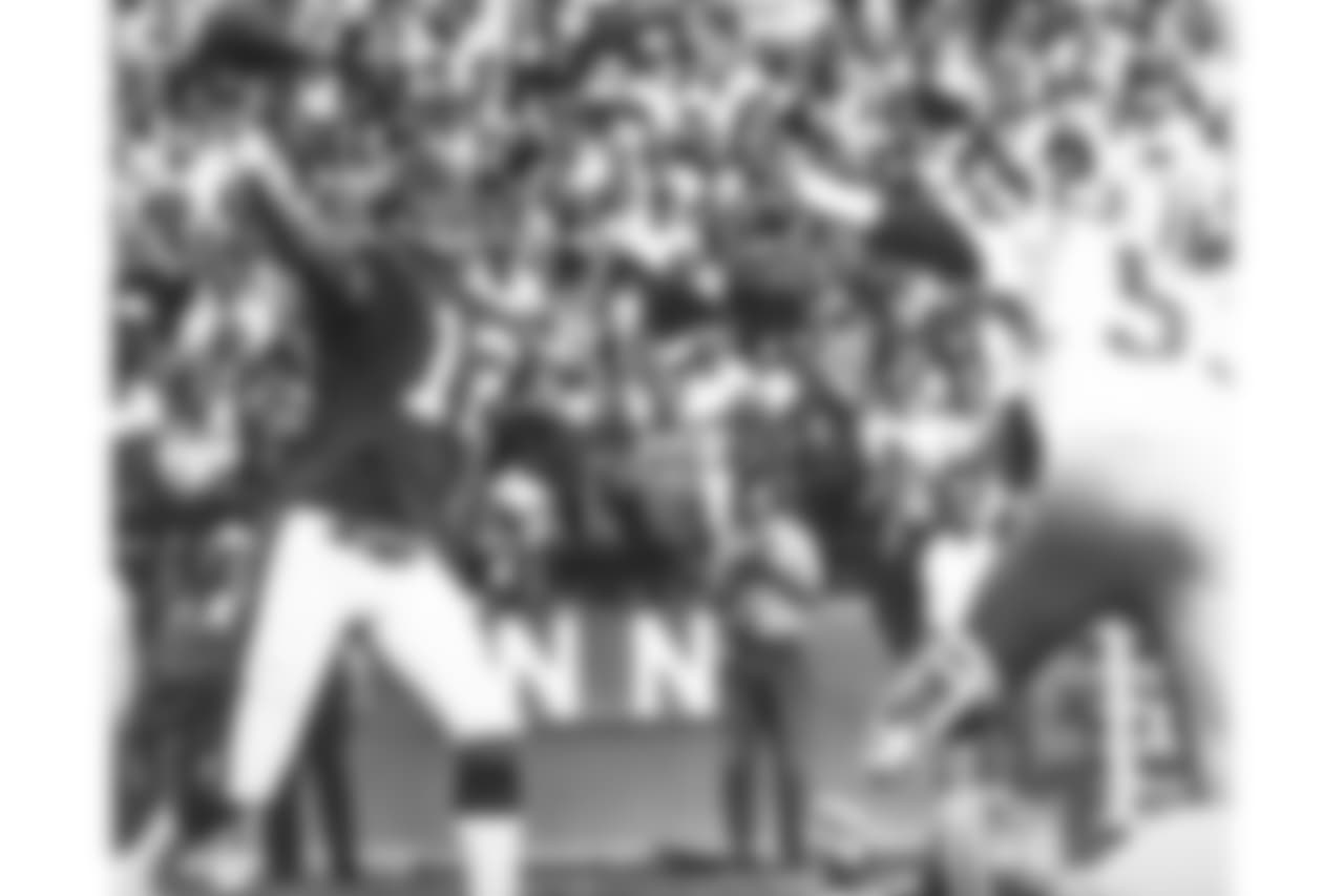 Quarterback Charley Johnson throws a pass during a game against the San Francisco 49ers at Mile High Stadium.