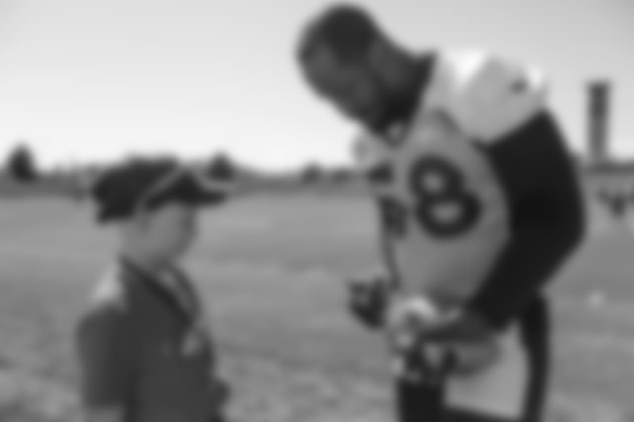 Chase, a Children's Hospital Colorado Junior Reporter, meets with Von Miller at UCHealth Training Center on September 26, 2018.
